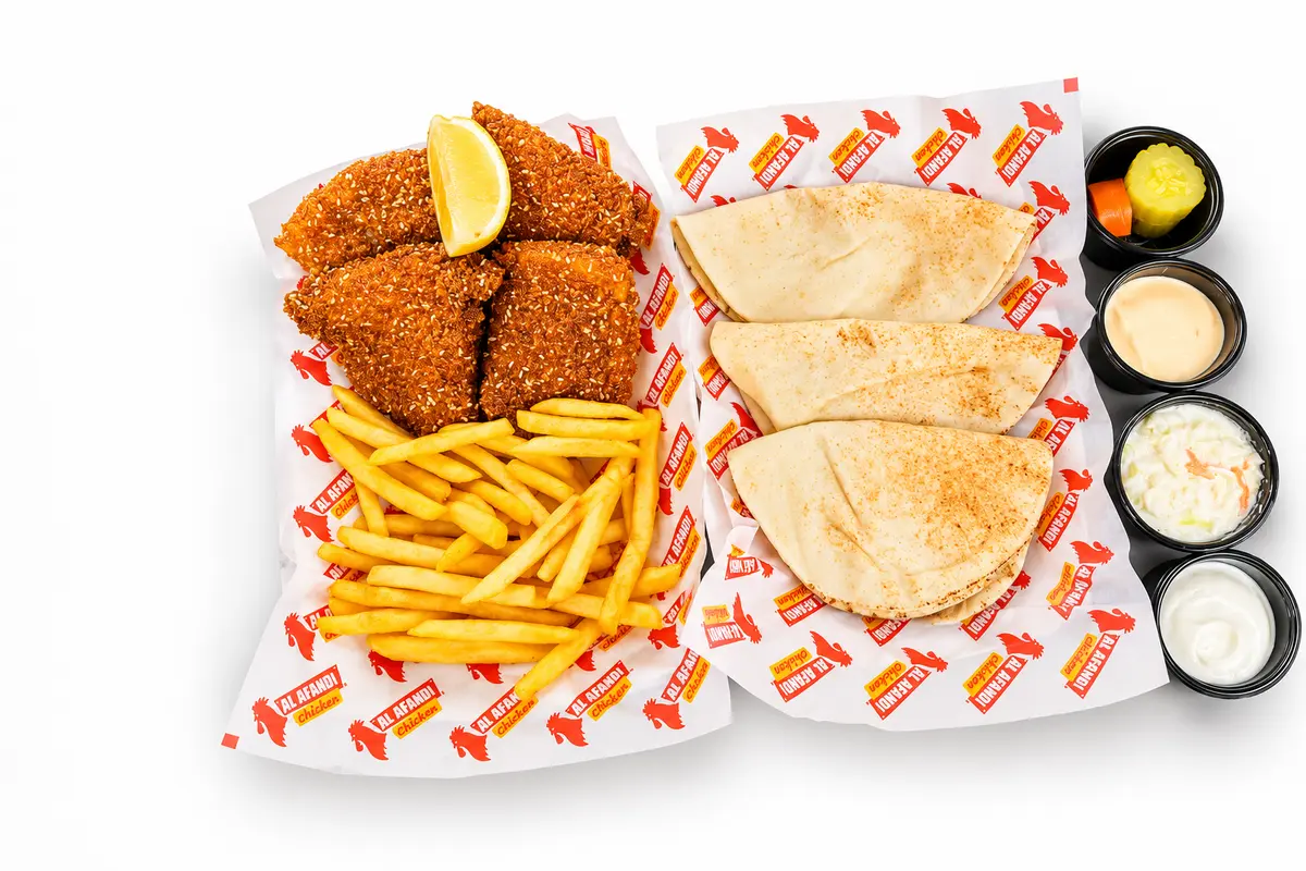 Fish fillet meal with fries, bread, garlic cream, coleslaw and pickles